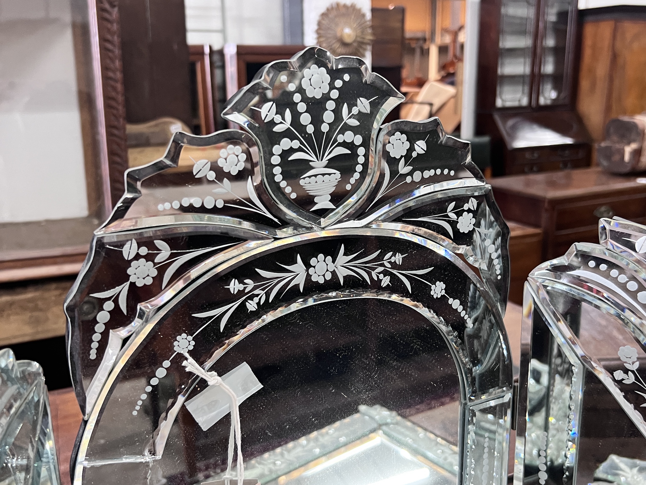 A Venetian style triple dressing table mirror, height 63cm together with a circular wall mirror, height 76cm